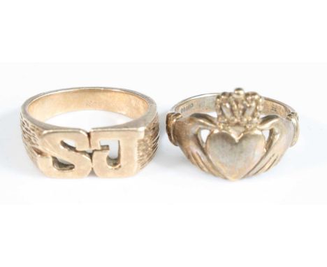 Two rings, being a 9ct yellow gold Claddaugh ring, size S½, hallmarked 9ct, London 1997; and a yellow metal initial ring with