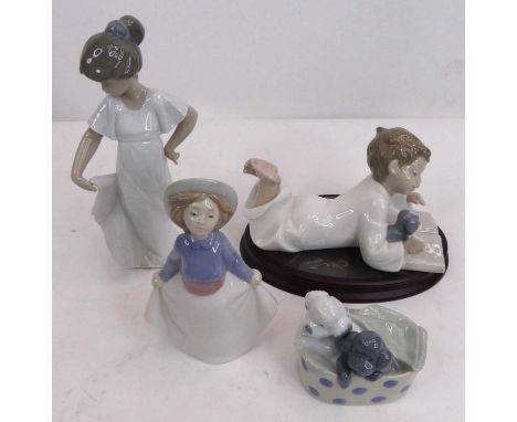 A collection of four Nao porcelain figures, the largest h.22cm, each boxed 