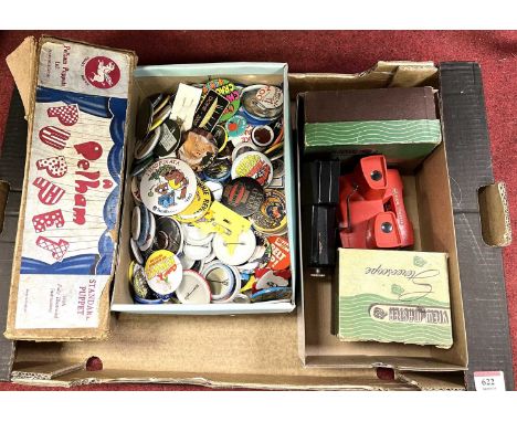 A collection of badges, together with a Pelham Puppet, and a collection of ViewmastersNo character name to the puppet.