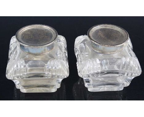 A pair of Edwardian cut glass inwells, each of square concave shape having a silver collar and hinged cover, makers William H