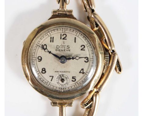A 9ct yellow gold Ditis Geneve non-magnetic manual wind wristwatch, having a round silver Arabic dial and dub-dial at 6 o'clo