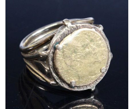 A yellow metal coin ring, featuring a 14mm coin engraved Polpon Emperor, with split shoulders, size approx M½, gross weight 8