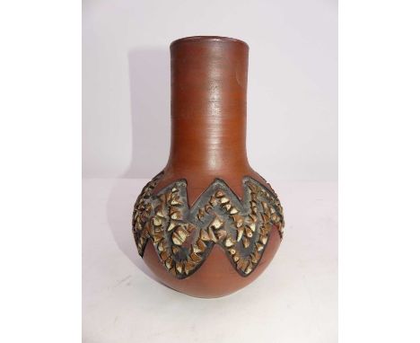 A Poole pottery vase, having incised geometric decoration, h.22cmGood condition.