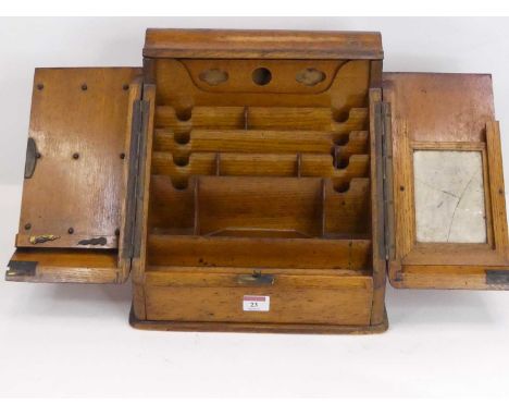 A Victorian light oak stationery box, the hinged doors opening to reveal fitted interior, w.30cm 
