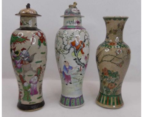 A Chinese famille rose porcelain vase and cover, enamel decorated with figures in a tree, h.35cm; together with two Nanking v