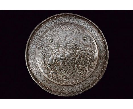 dating: about 1620 provenance: North Italy, Made of iron, round and convex, with a raised and twisted edge, majestically embo