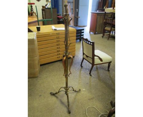Attractive early C20th Art Nouveau style tall metal Lamp Stand, raised on three scrollwork feet with typical decoration,
