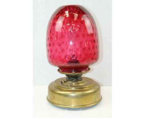 Early 20th century oil lamp with sun burner and large brass reservoir, stamped - S. H. L. R. Wood Birmingham, deep cranberry 
