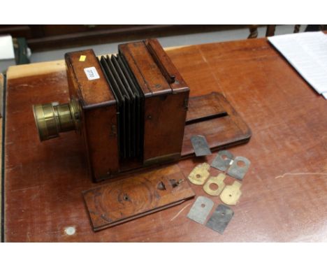 An early unnamed wooden plate camera with focusing brass lens and original Waterhouse stops