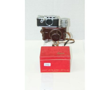 Leica IIIf red dial D/A 35mm camera no. 684877, fitted with a 5cm f1-5 Summarit lens, together with maker's leather case, cap