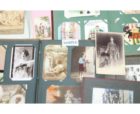 Postcards in two albums - including greetings, fairies, Father Christmas, toys, Louis Wain 'Birthday Happiness be Yours', shi