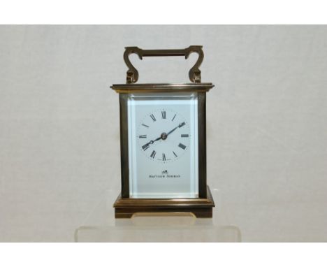 Swiss-made brass carriage clock with enamel dial, by Matthew Norman   CONDITION REPORT  Good overall - in working condition -