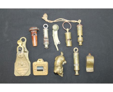 Victorian brass Merry Phipson & Parker letter clip, another by Lund's London, together with a brass model of a dog and a coll