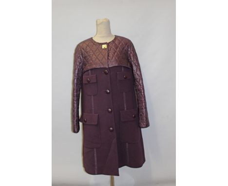 Louis Vuitton ladies' purple coat with Louis Vuitton gilt fastening at neck, pockets and buttons detailing and quilted top ha
