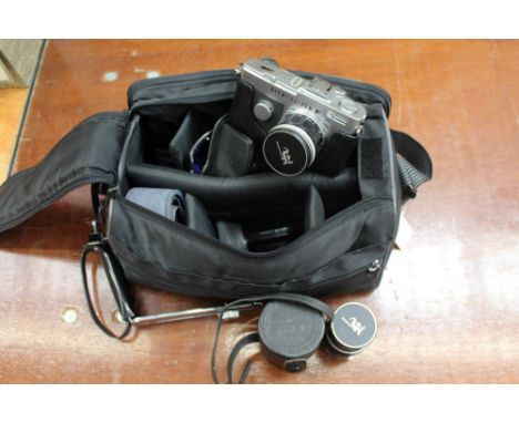 Olympus - Pen F camera with two Olympus lenses and associated accessories in camera bag
