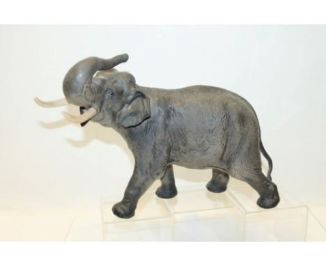 Large Beswick figure of an Elephant with raised trunk, 37cm in length. Printed marks to base Beswick England   CONDITION REPO