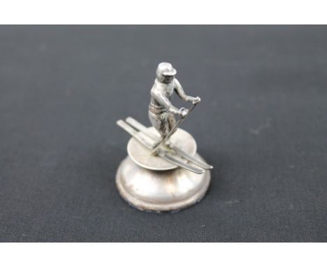 Novelty Scottish silver model of a skier, raised on plinth base, hallmarked - Edinburgh 1955, maker - A.E., 5.5cm high