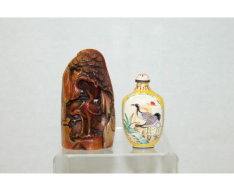 Chinese carved soapstone bolder ornament decorated with cranes, 10.5cm and Chinese Canton enamel snuff bottle, painted with c