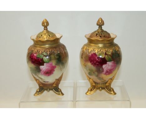 Pair of Royal Worcester pot pourri vases and covers hand decorated with pink roses on a blush ground.  Printed marks to base 