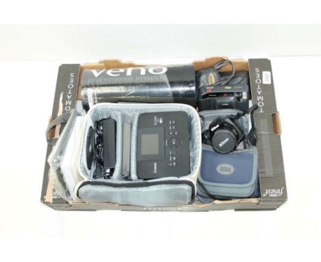 A Nikon Coolpix P100, a Canon Selphy printer, a Veho scanner and a Lumix Panasonic digital compact camera