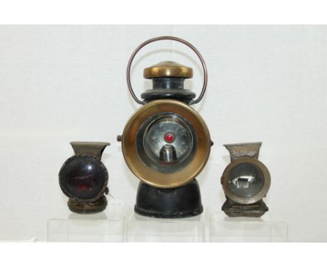 Large 'Lucas' brass mounted railway lamp, together with a Lucas Petroleum Silver King cycle lamp and another similar, by Powe