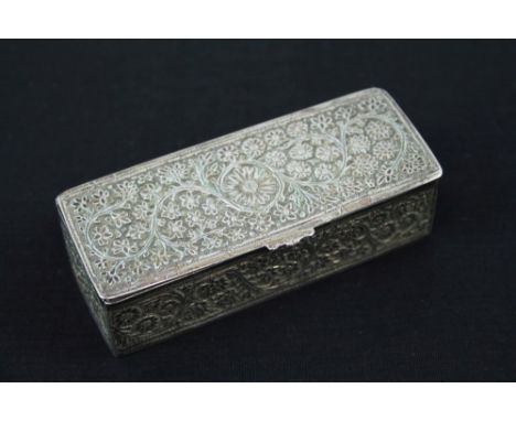 Early 20th century Indian white metal trinket box of rectangular form, with engraved foliate decoration, 10cm long