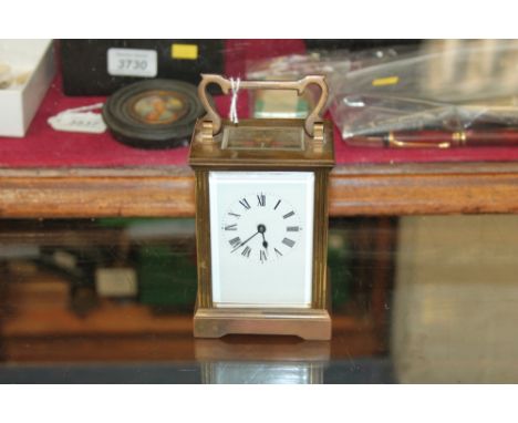 Mid-20th century carriage clock with French eight day timepiece movement and lever escapement, white enamel dial with Roman n
