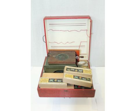 Early 20th century magic lantern with a large selection of glass slides in a carrying case, together with an interesting Vict