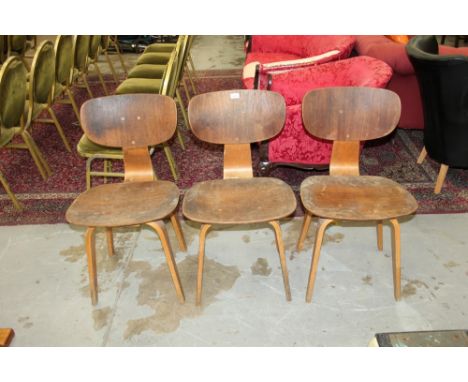 Set of three early Eames bent plywood chairs, model DCW, raised on square splayed tapered legs