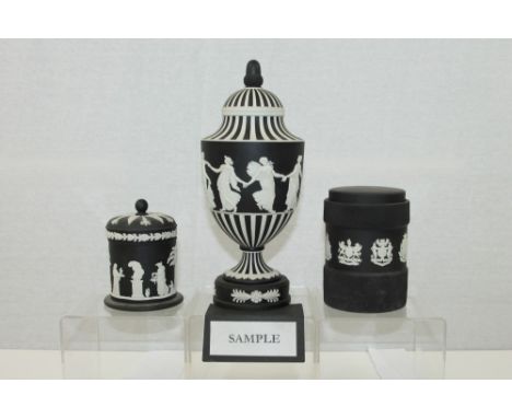 Group of black Wedgwood Jasper ware - including two urns with covers, vases, pots, trinket box, bowl and pin dishes (12)   CO