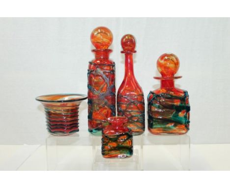 Selection of Mdina  red tinted glassware with blue trailed decoration - comprising three decanters with stoppers, vase and on