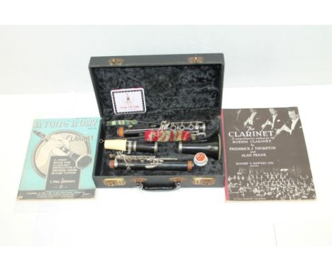 F. Buisson model 90 clarinet in a fitted case and two playing instruction books (3)