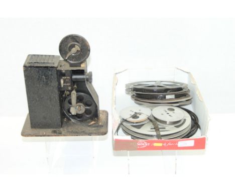 Vintage cine camera with quantity of films and reels