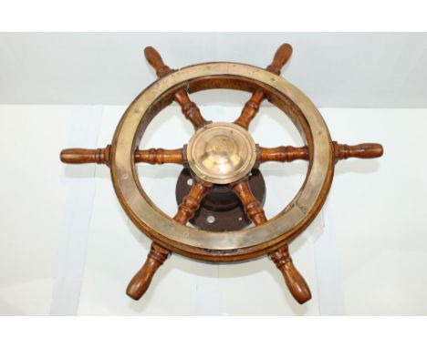 Old brass mounted wooden ships' wheel, faintly marked - Y K NOT GNBC., 57cm diameter