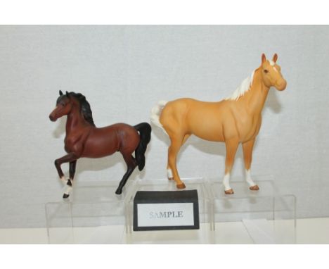 Group of four Beswick horses with matte finish - Palomino, black, brown and brown foal