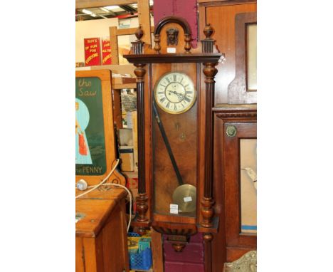 Late Victorian Vienna Regulator-style wall clock with eight day movement striking on a gong, recessed cream enamel dial, chap