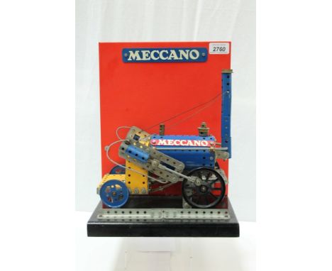 Meccano - shop display model for a four-wheel steam engine, mounted on wooden plinth, with backboard 