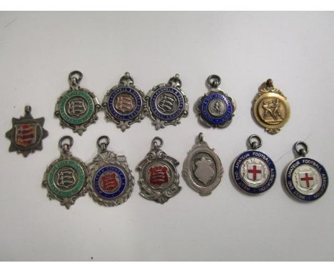 A group of silver enamelled and metal enamel football medals, circa 1940, to include Hanwell Hospital Charity Cap, Middlesex 