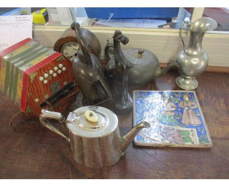 A mixed lot to include a 19th century Persian tile, a squeeze box, an oak cased clock, a silver plated teapot and a pewter te