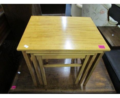 Herbert E Gibbs - a light wood nest of three tables, 18 7/8" x 18" x 14" and a light wood side cabinet on turned legs and blo