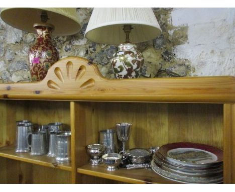 A mixed lot to include two china table lamps, various pewter tankards with enamel badges, silver plate and plates decorated w