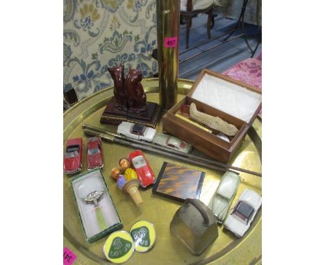 An interesting lot to include a pair of Lotus enamelled car discs, brassware, a Jade handled magnifying glass, a wooden Egypt