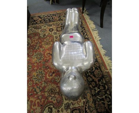 A cast aluminium tobogganist on sled, 42" long 