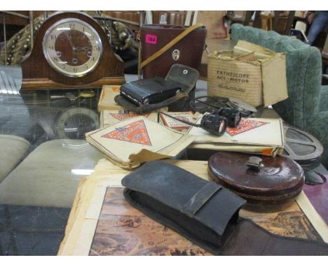 Vintage Pathescope film reels, a vintage leather cased tape measure, a Zeiss camera, a bible, a Croydon & Sons of Ipswich mid
