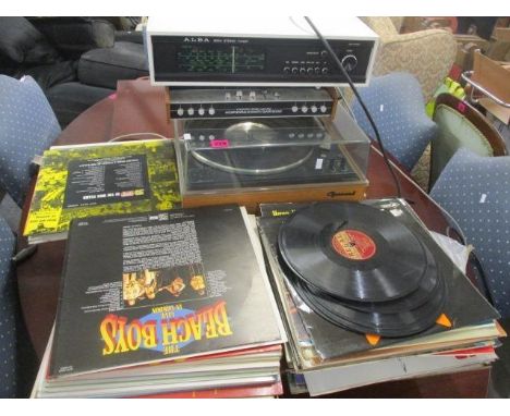 A Garrard turn table together with a stereo tuner, an amplifier and mixed records 