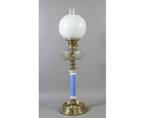 A Victorian oil lamp with cut glass font and column base.