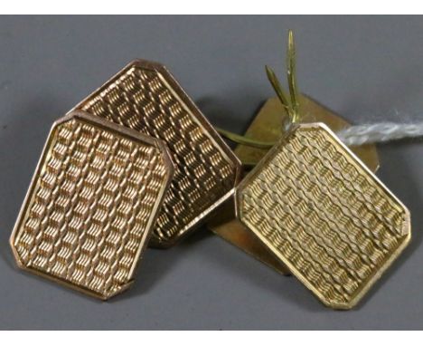 A pair of gentlemens 9 carat gold cufflinks with engine turned decoration.
