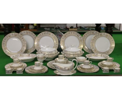A large Wedgwood dinner service decorated in the Golden Florentine pattern including tureens, dinner plates, coffee cups and 