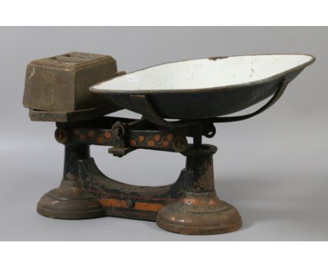 A pair of old cast iron scales and weights.