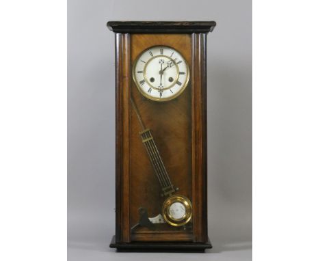 A 19th century walnut cased Vienna wall clock with enamel dial.